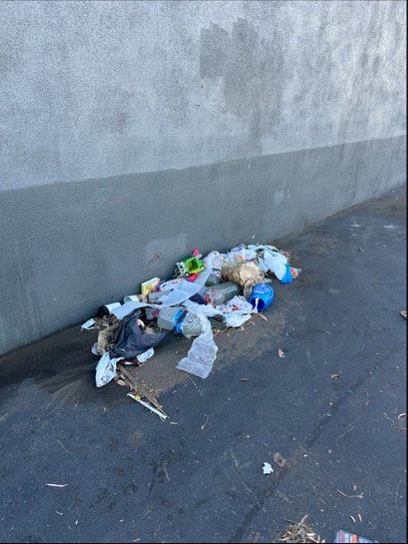 Before — Debris against wall